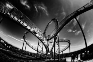 Black and white photo of twist and turn roller coaster