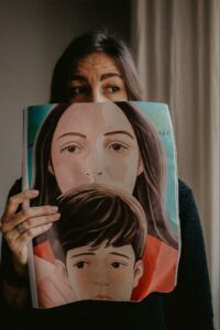 Woman holding image of sad person