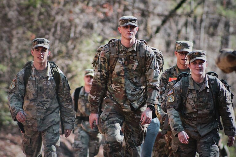 A group of soldiers walking together in support of each other