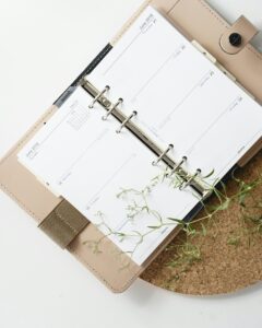 A planner with some foliage next to it